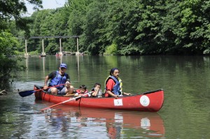 Community members paddling at the 2008 Bronx River Festival. 2000 people, including 800 students, participated in canoe tours in 2013. Photo courtesy of Bronx River Alliance.