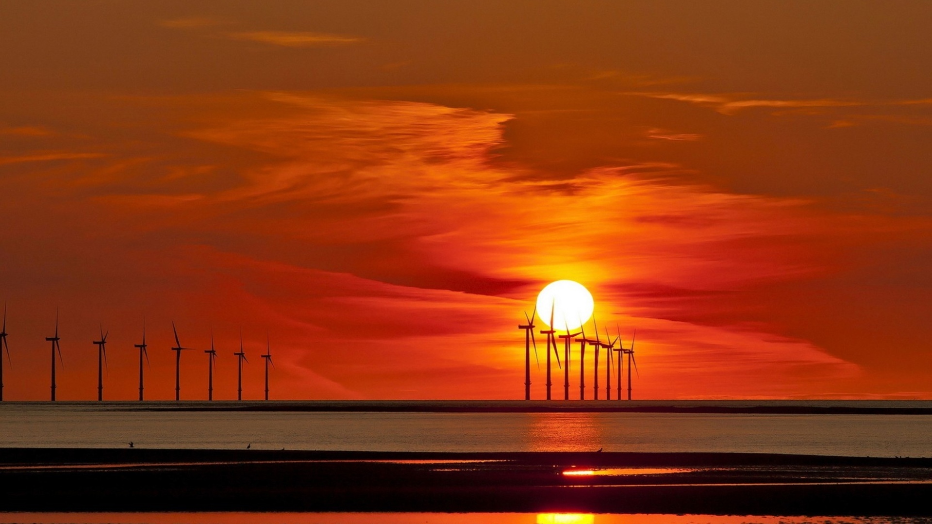 offshore turbines at sunset
